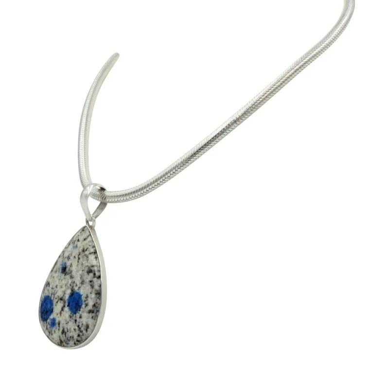A graceful large teardrop shaped K2 Jasper statement Pendant in open back bazel setting
